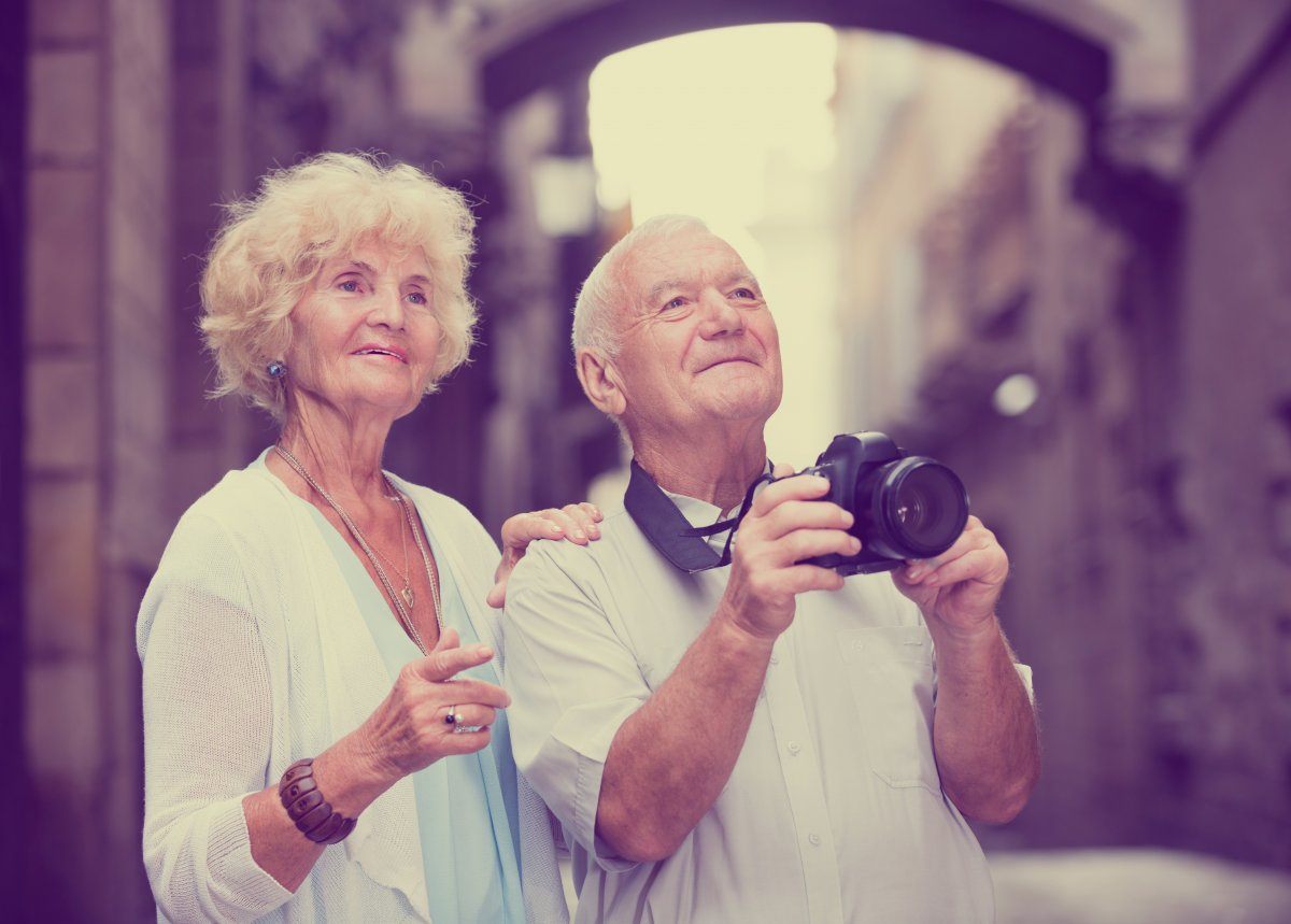 Romantic Senior Couple Making Photo City
