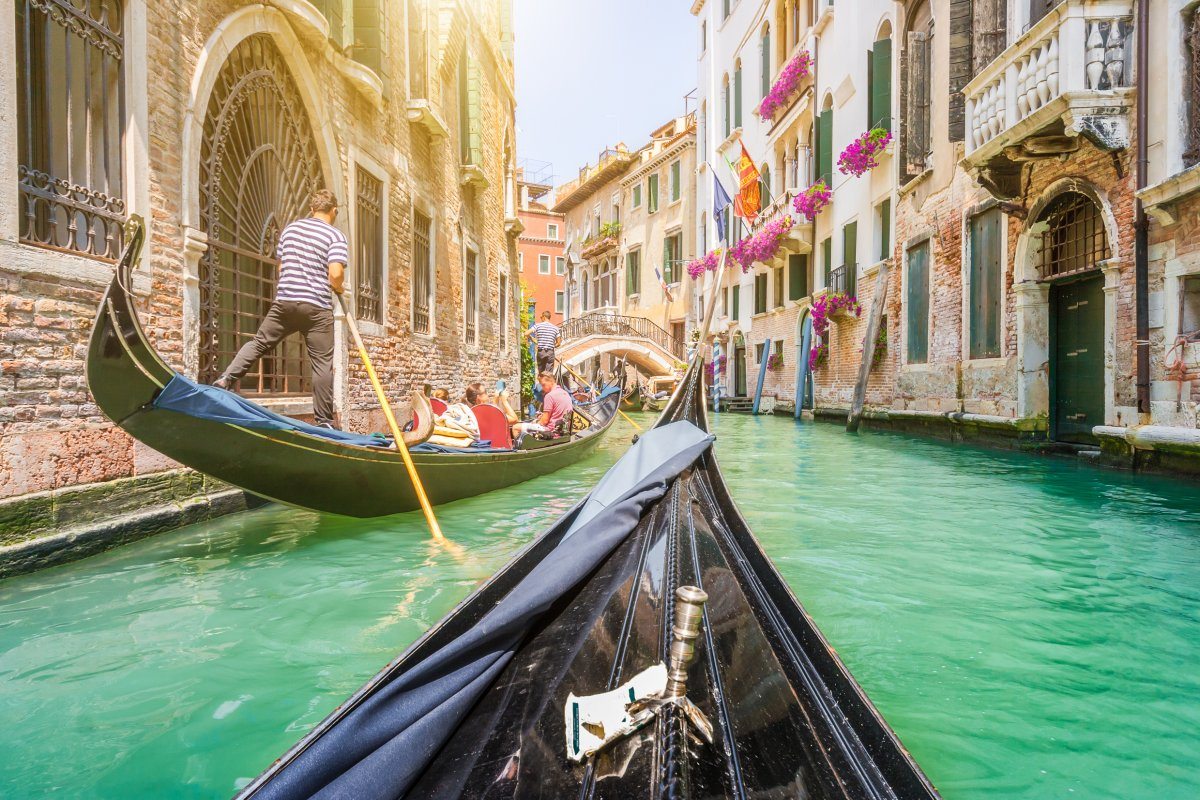 Traditional Gondolas On Narrow Canal Venice
