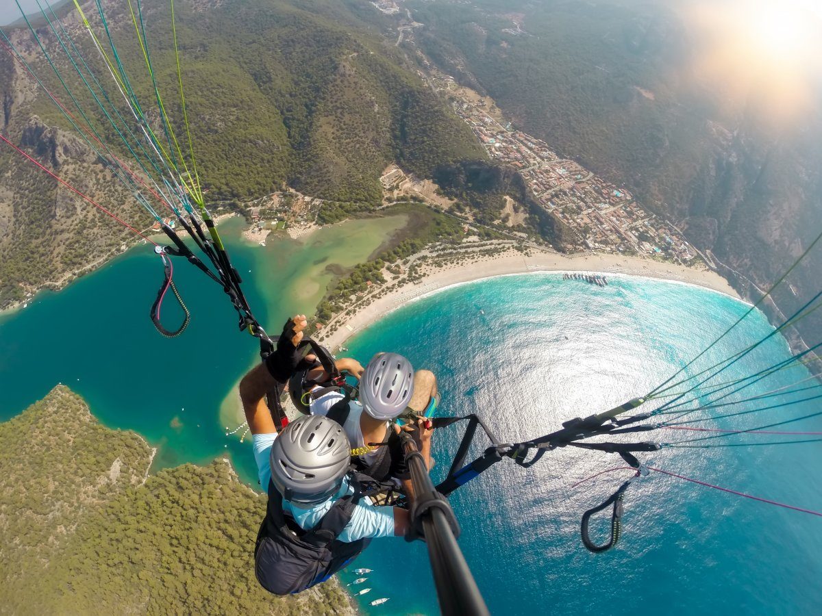 Paragliding in the sky with a view of the Blue Lagoon in Oludeniz, Turkey