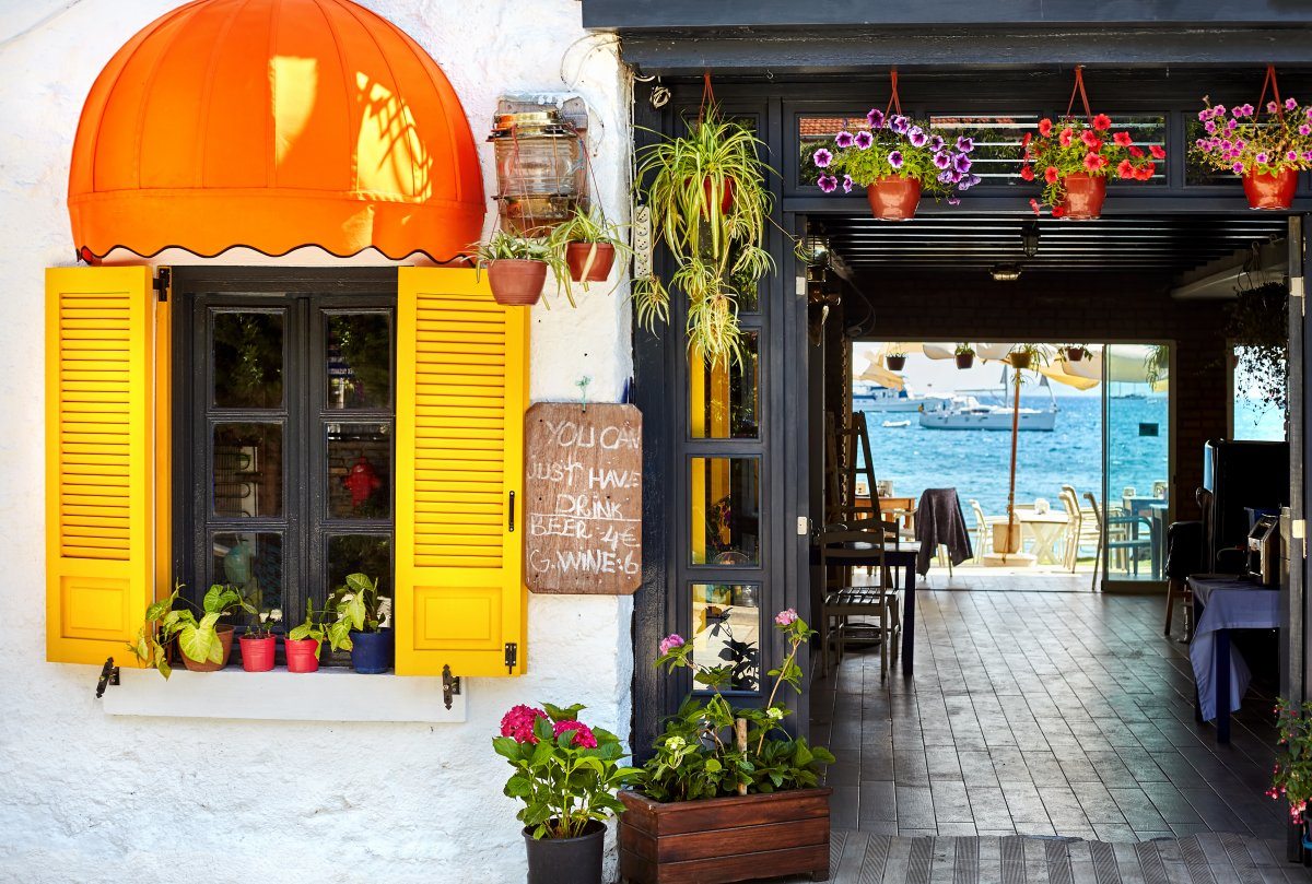 Street Cafe with tables and seaside view in Bodrum, Turkey