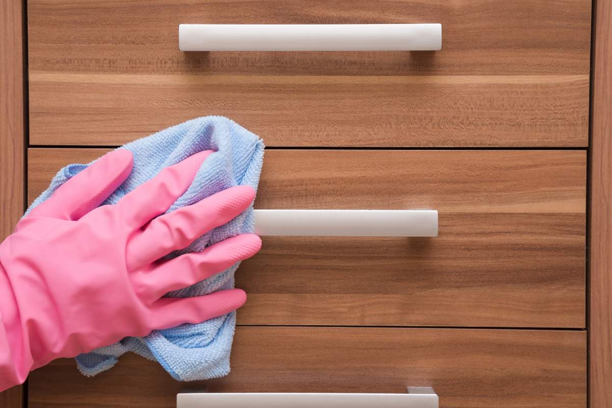 hand in rubber protective glove cleaning