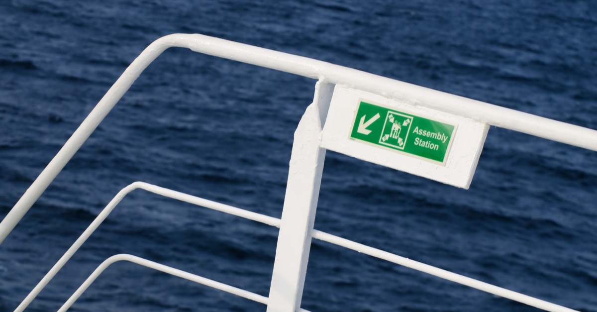 sign for passengers indicating where to congregate in an emergency