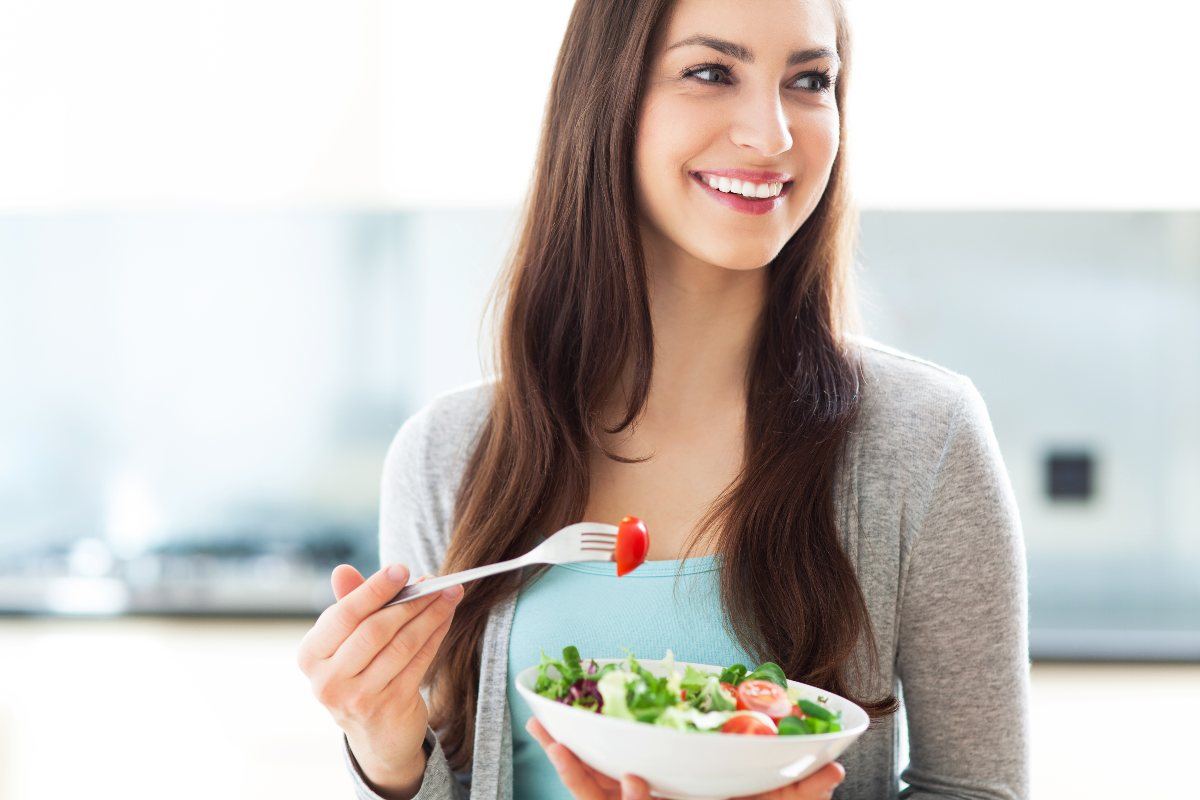 woman eating salad